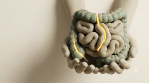 A sculpted matte clay coiled intestine cradled in cupped hands, with a bright golden seam running along a break in the form.