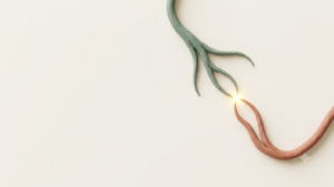 Two clay branching nerve filaments almost meeting, with a golden spark at the junction
