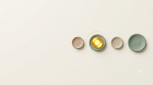 Four clay discs in a curving line marking massage points, one glowing with golden light