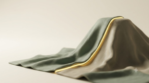 Sage-green clay cloth draped over an unseen form, with a bright golden seam running down the ridge of the fold.